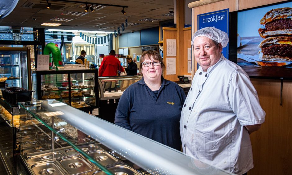 Owners James and Julie Haig behind the deli counter installed at their Aberdeen shop in 2022.