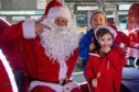 Santa gets to meet brothers Franklyn and Cameron Hossack, aged 6 & 4