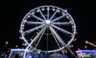 The ferris wheel is lit up at night for Dundee's Winterfest