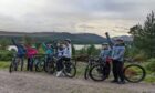 Ukrainian pupils explore Kingussie on bikes donated by volunteers. Image: Kingussie High School