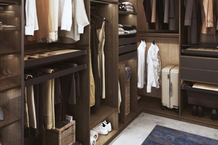 Bespoke wardrobe with dedicated spaces for items, from clothes and shoes to suitcases.