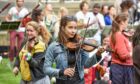 Violinist playing at free Aberdeen music festival