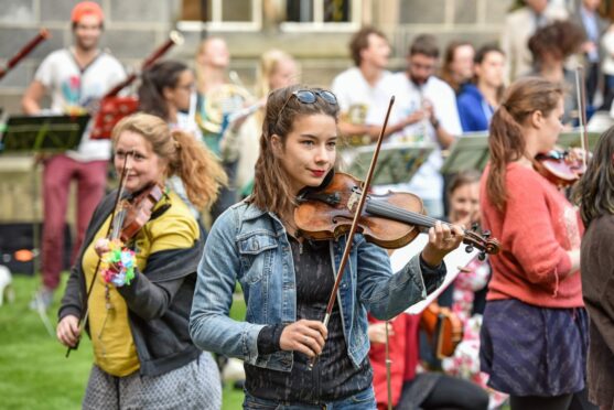 Violinist playing at free Aberdeen music festival