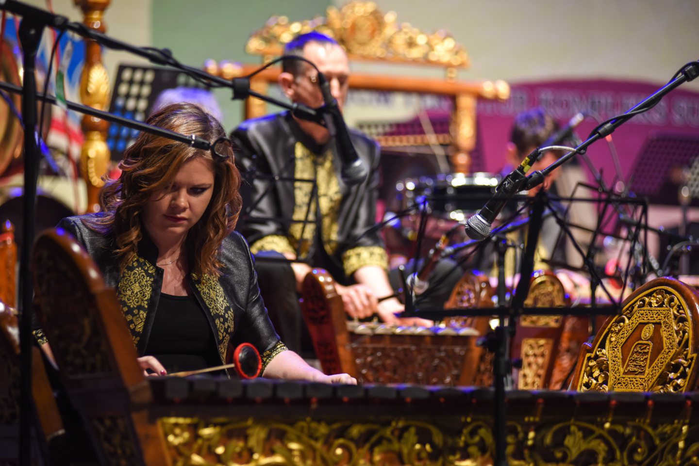 musician playing the gamelan gong kebyar in Aberdeen