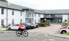 Staff at Rosewell House, Aberdeen, are being encouraged to cycle to work in a bid to lessen parking problems.