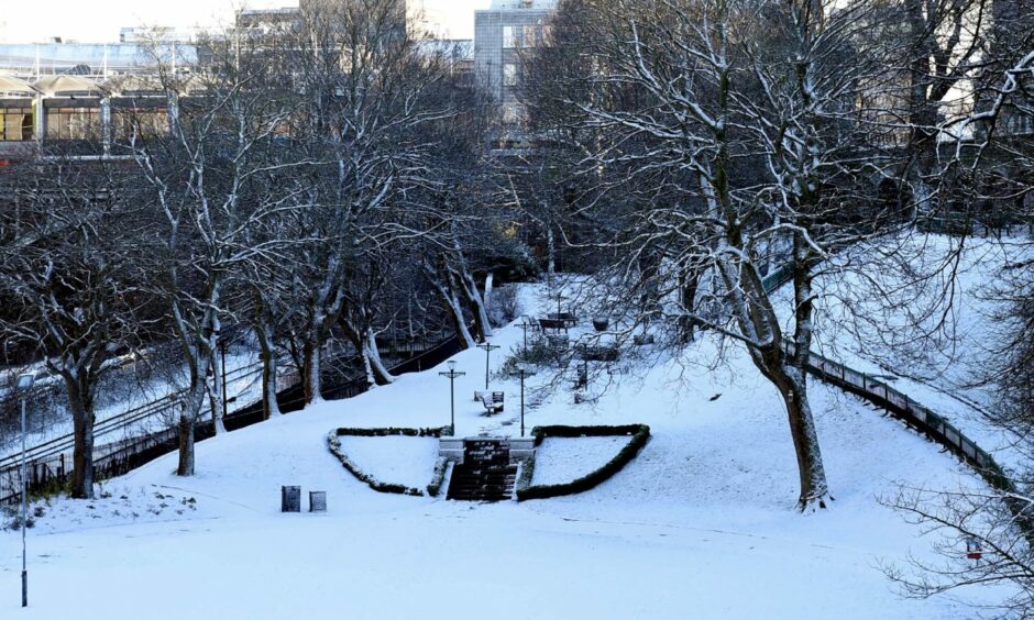A snowy scene on the Union Terrace Gardens lawn in February 2019, a few months before the £30m work began. Image: Heather Fowlie/DC Thomson.