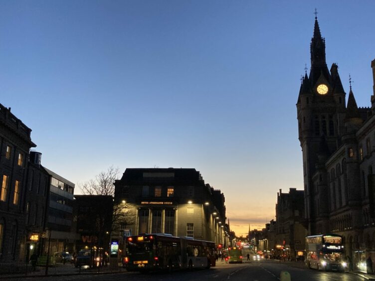 From Castlegate looking down Union Street at dusk, with the Town house clock tower on show. 