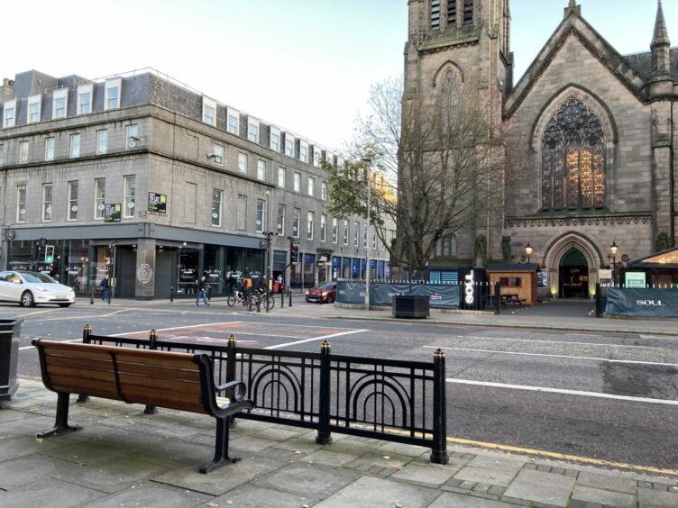 The bench outside of Pret looks across from one side of Union Street across to Soul, with a metal fence located in front of it