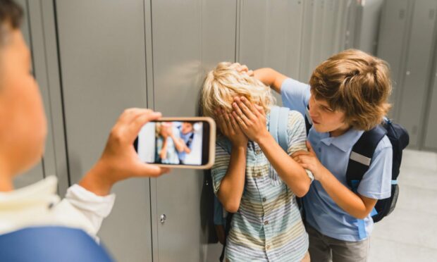 It can be emotional to learn your child is being bullied. But experts say that discussing it with them is better than leaping into action.