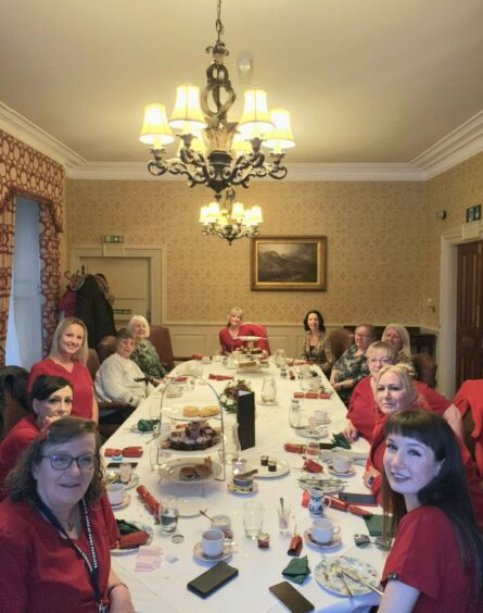 Sheila Forbes with staff and clients of Peaky Minders