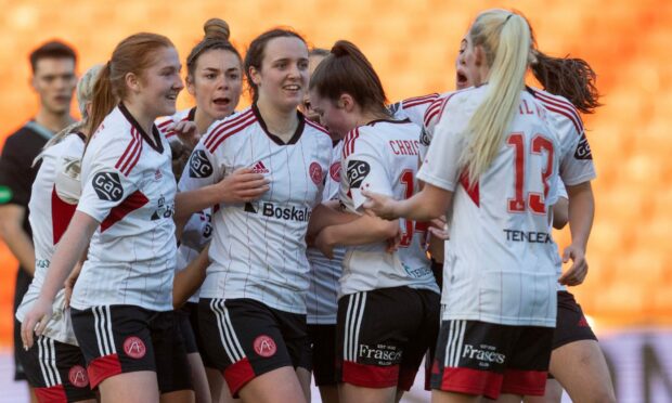 Aberdeen Women celebrate after Bayley Hutchison's winning goal against Dundee United. Image: Shutterstock.