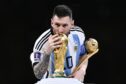 Lionel Messi with the World Cup. Photo by Fabio Ferrari/LaPresse/Shutterstock.