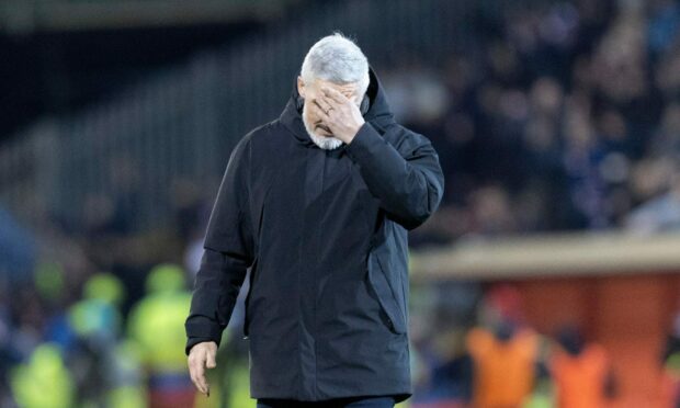 Aberdeen manager Jim Goodwin looks dejected after the 3-2 loss to Rangers. Image: Stephen Dobson/ProSports/Shutterstock