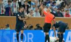 Referee Szymon Marciniak shows a yellow card to France's Adrien Rabiot during the World Cup final.  Image: Shutterstock.