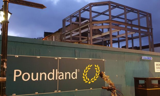 Poundland rebuild framework with the 'Poundland' logo in front of it