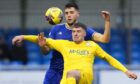 Cove Rangers' Jack Sanders defends against Morton's Robbie Muirhead. Image: SNS