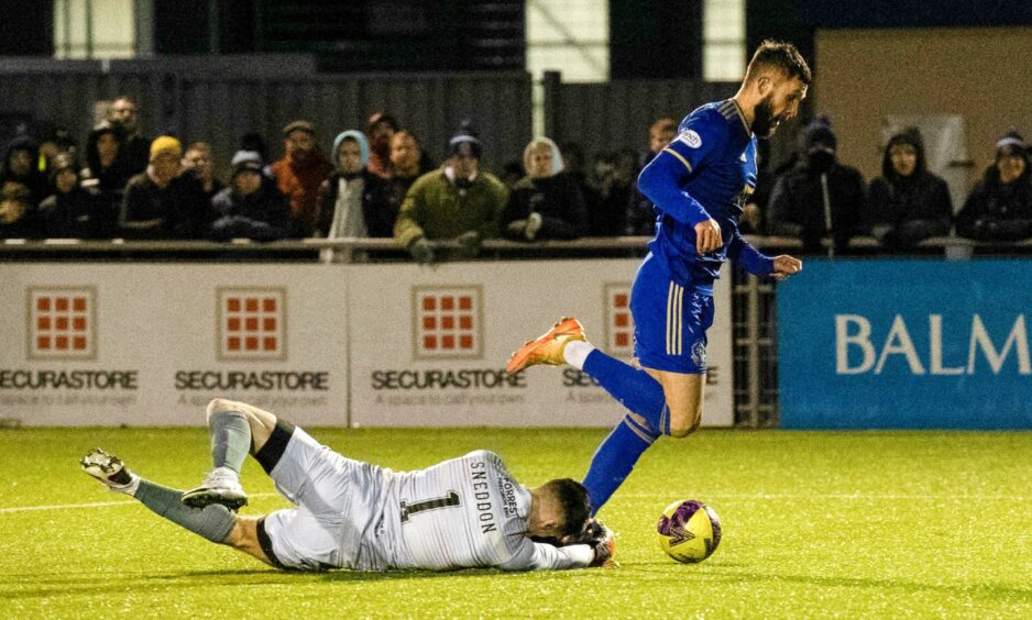 Cove Rangers striker Gerry McDonagh is kept out by Jamie Sneddon. Image: SNS