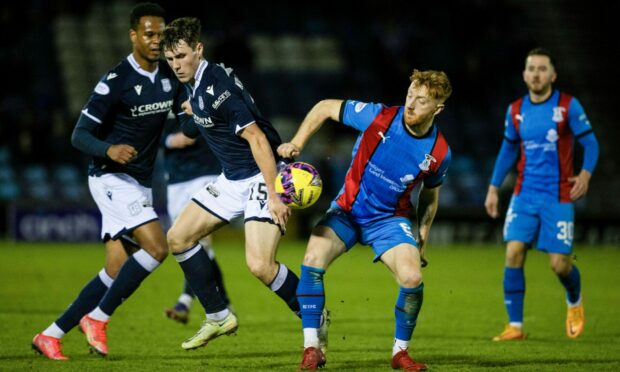 David Carson in the thick of the action for Caley Thistle against Dundee. Image: SNS Group