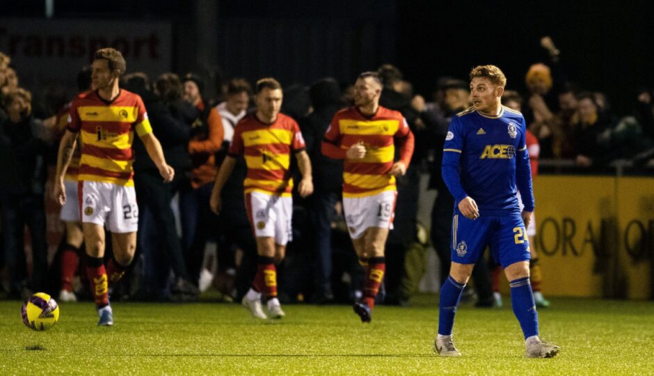 Cove Rangers midfielder Fraser Fyvie looks on as Partick Thistle celebrate their late leveller. Image: SNS