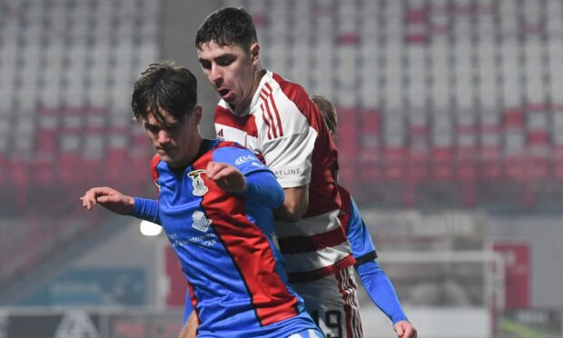 Inverness' Matthew Strachan and Hamilton's Andrew Winter in action last week in the SPFL Trust Trophy. Image: SNS Group