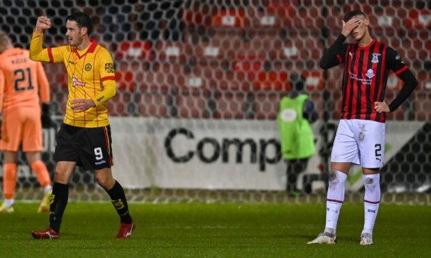 It's delight for Partick striker Brian Graham and despair for Wallace Duffy after the opening goal. Image: SNS