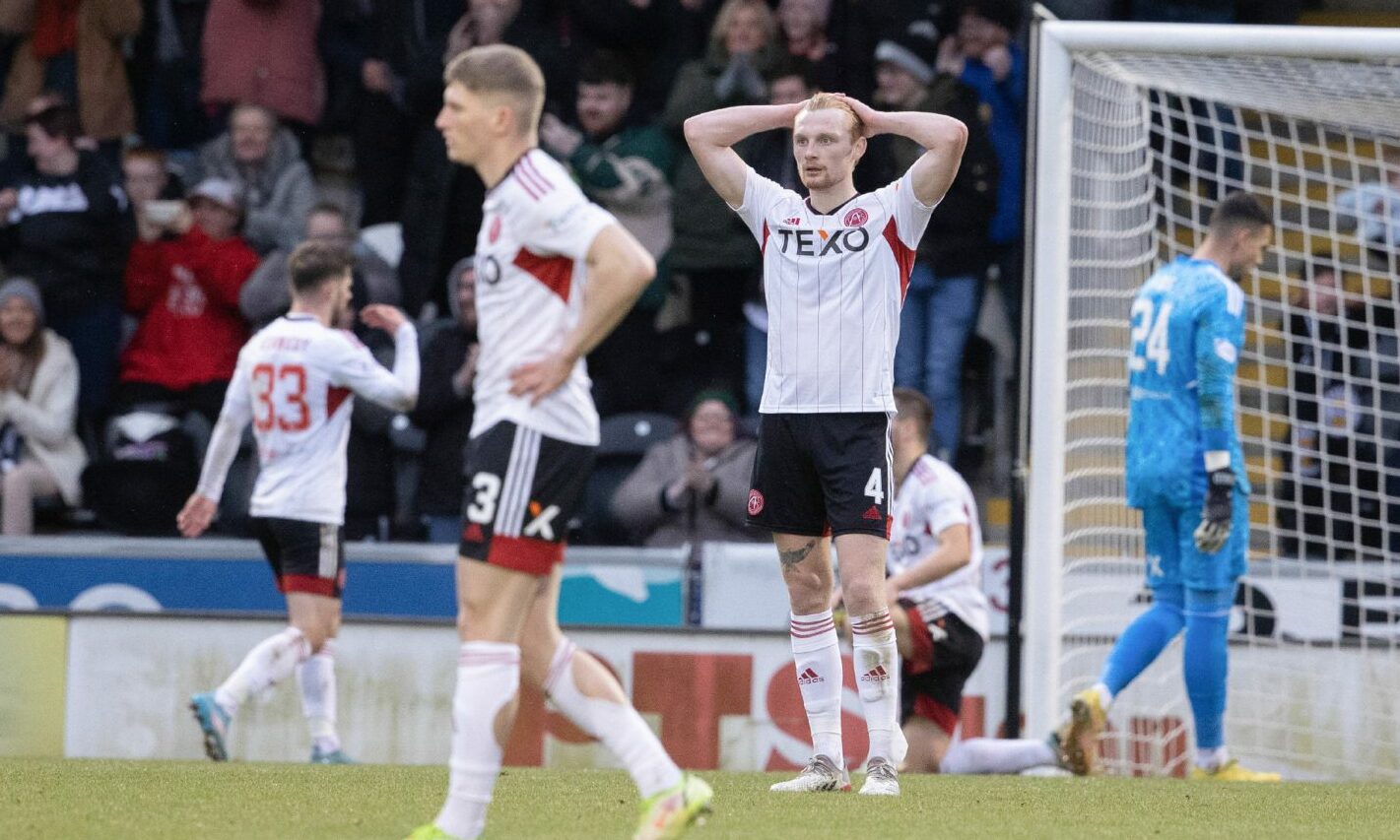 Aberdeen's Liam Scales looks dejected in the match against St Mirren. Image: SNS.