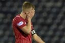 Ross McCrorie was dejected following Aberdeen's defeat at Kilmarnock. Image: SNS