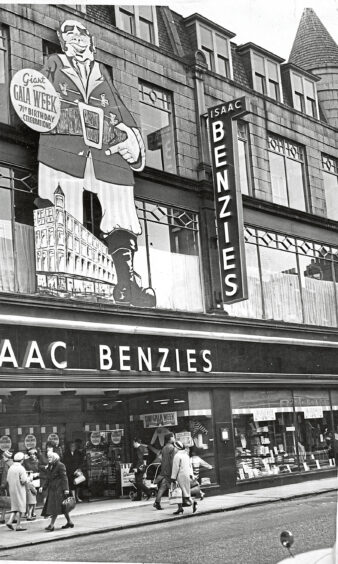 A sign of a giant above an Isaac Benzies store on george street