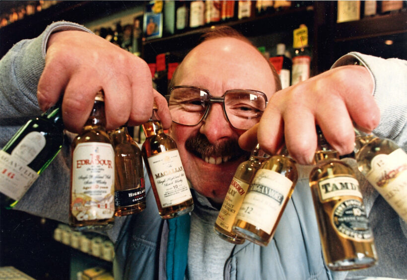 1991 - Bruce Hendry of the Still Man whisky shop on Aberdeen's Holburn Street, with just some of his whiskies.