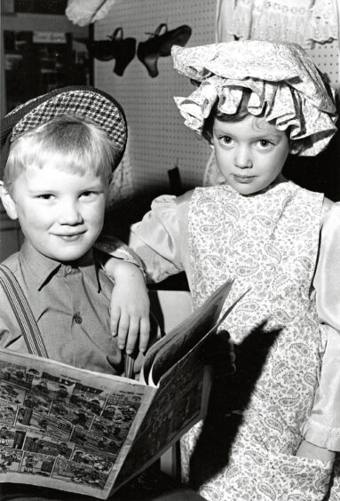 1981 - Ewan Wyness and Claudia Bell, both 5, get ready to take to the stage for Methlick Primary School's "Good Old Days Concert" as part of the school's centenary celebrations.