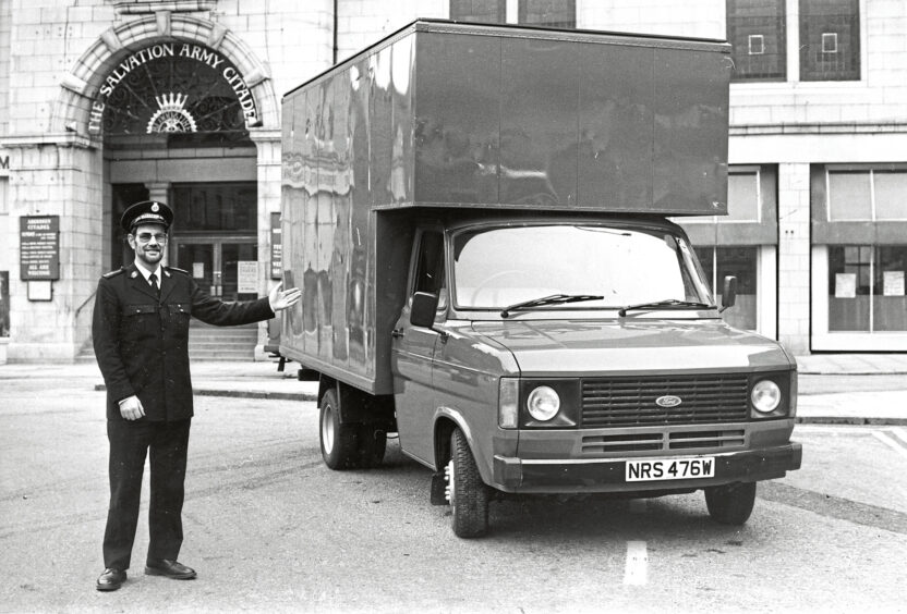 A man standing next to a van that had been donated outside the Salvation Army Citadel