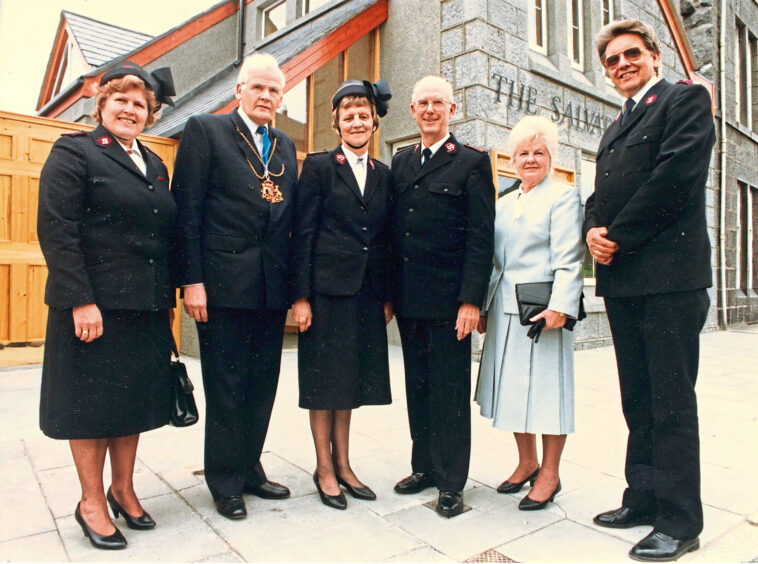 A group of people, including the lord provost, standing in front of the Salvation Army Aberdeen building