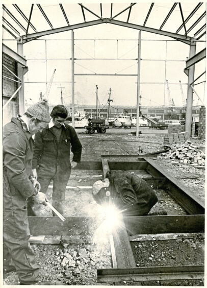 1979 - Edward Weston, Robert Hepburn and Ian Shand hard at work on Aberdeen Trawlerowners and Traders Engineering Company's new extension. Strikes had held up work on the project. 