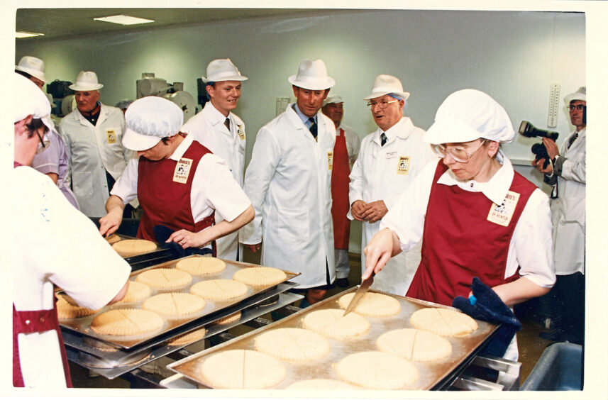 1994 - The then Prince Charles is reminded of the shortbread his grandmother used to make during a visit to Deans of Huntly. 