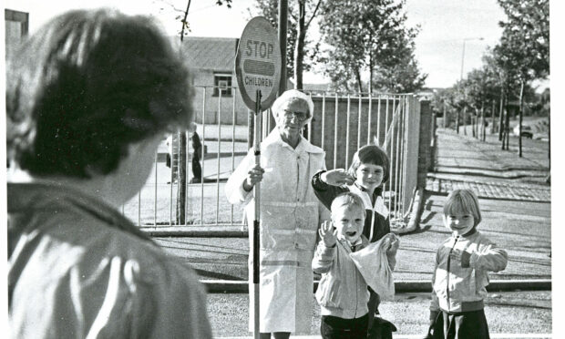 1983 - Marie-Louise McBain, who was going to school for the first time, brother Paul and pal Angie Morrison wave at mum Ray McBain on their way to Fernielea School.