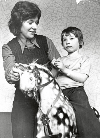 1976 - Sheila Moore and her son Colin, 5, share a more playful moment after travelling down from Orkney for treatment at Aberdeen Children's Hospital. 