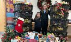 The girls handed in their donations to the Westhill community church food bank. Image: Leigh Baxter.