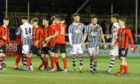 The Elgin players congratulate Clyde following the penalty shootout. Image: Robert Crombie.