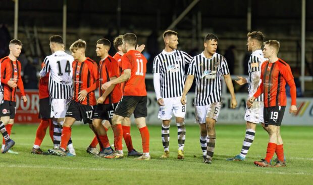 The Elgin players congratulate Clyde following the penalty shootout. Image: Robert Crombie.