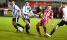 Formartine's Scott Lisle, second from right, tries to evade the Fraserburgh defence
