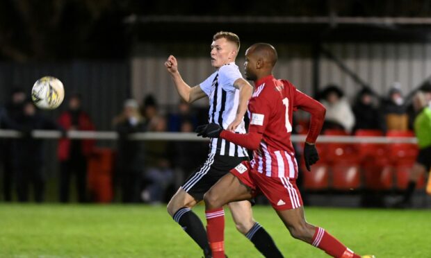 Kieran Simpson of Fraserburgh, left, battles with Formartine United's Julian Wade