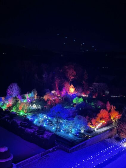 Aerial picture of Crathes Castle lit up for the Christmas holidays.