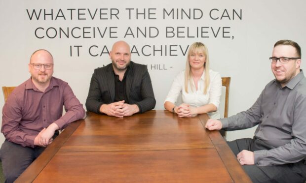 Jamie Dunlop, Fraser Bryce, Linda MacPhee and Douglas Laird, with an inspirational boardroom background at Dicksons. Image: Milestone Media