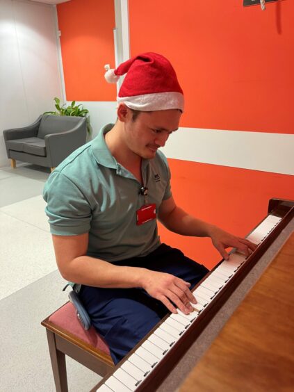 Friends of Anchor Pianist Harry Hendry playing piano for radiotherapy patients 