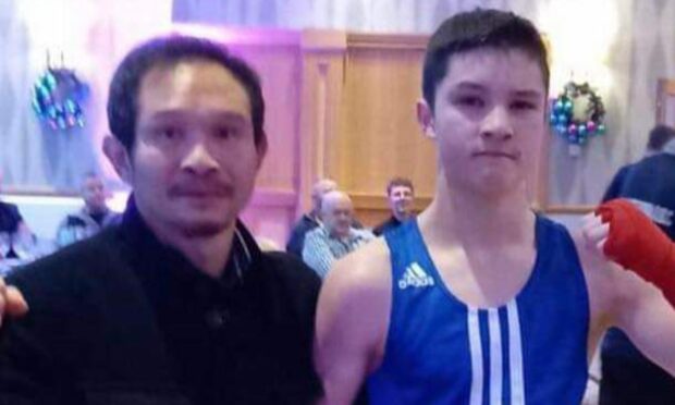 Jonathan Karnphan, right, after his latest win at the Drumossie Hotel, Inverness, with his dad, Rung, a former Thai boxing world champion.