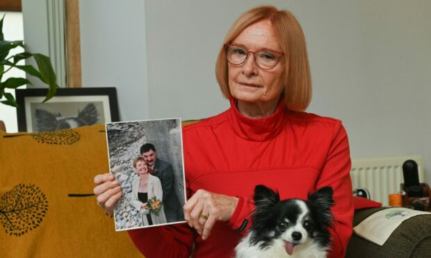 Tina McGeever, with a photograph of her husband Michael. Image: Jason Hedges/DC Thomson