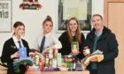 Buckie High School pupils are the driving force behind the town's community food larder. Left to right: Pupils Nicole Taylor Natalie Kobedza, Lucy Taylor and teacher Stewart Clelland. Picture: Jason Hedges/DC Thomson