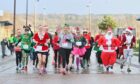 Santa leads from the front in the Jingle Jog at Inverness Campus. Image Jason Hedges/DC Thomson