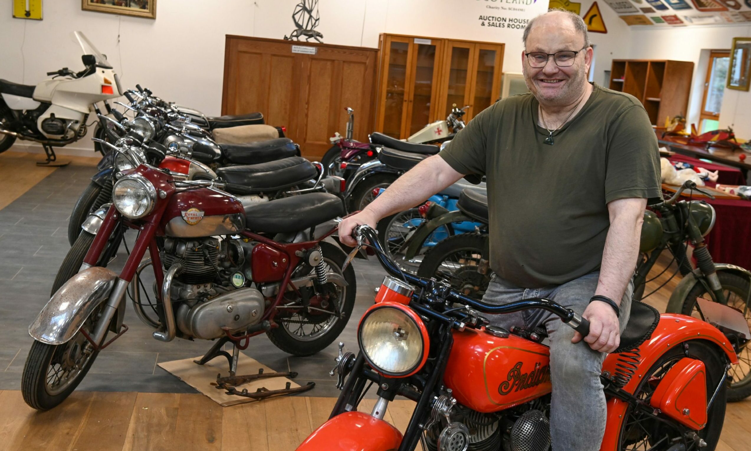 Clive atop the "rare as hens' teeth" Indian Scout, to be sold on December 29. Image: Kenny Elrick/ DC Thomson