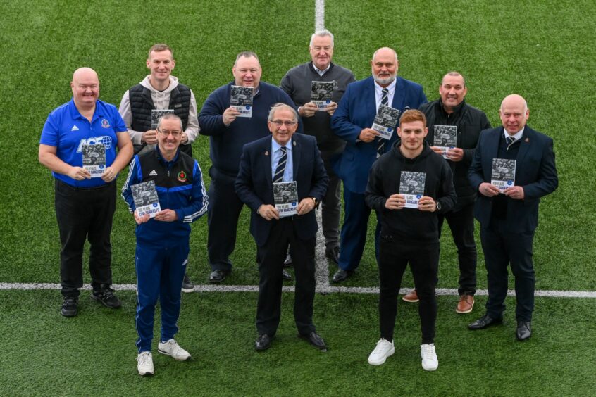 Fraser Fyvie, front right, at the launch of Cove Rangers' centenary book. Image: Kenny Elrick/DC Thomson